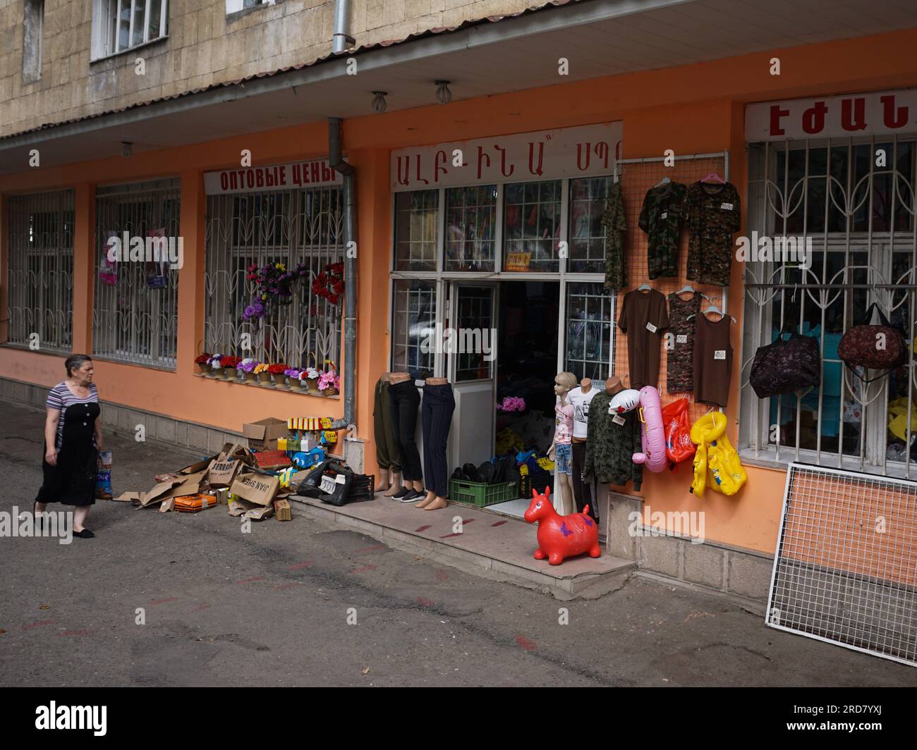 A woman seen walking past a store on the street of Stepanakert, Nagorno-Karabakh. The unrecognised yet de facto independent country in South Caucasus, Nagorno-Karabakh (also known as Artsakh) has been in the longest-running territorial dispute between Azerbaijan and Armenia in post-Soviet Eurasia since the collapse of Soviet Union. It is mainly populated by ethnic Armenians. Stock Photo