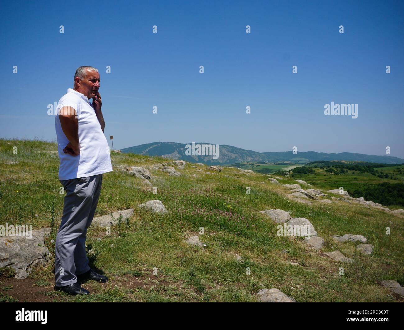 A man seen at one of the mountains in Shusha, Nagorno-Karabakh. The unrecognised yet de facto independent country in South Caucasus, Nagorno-Karabakh (also known as Artsakh) has been in the longest-running territorial dispute between Azerbaijan and Armenia in post-Soviet Eurasia since the collapse of Soviet Union. It is mainly populated by ethnic Armenians. Stock Photo