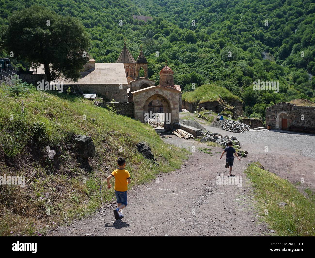 Children seen running outside the Dadivank, an Armenian Apostolic monastery, in Kalbajar, Nagorno-Karabakh. The unrecognised yet de facto independent country in South Caucasus, Nagorno-Karabakh (also known as Artsakh) has been in the longest-running territorial dispute between Azerbaijan and Armenia in post-Soviet Eurasia since the collapse of Soviet Union. It is mainly populated by ethnic Armenians. Stock Photo