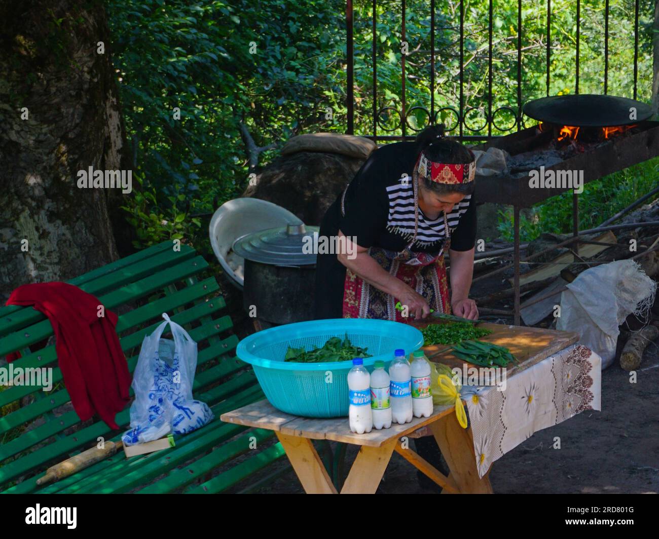 A lady seen preparing food outside Dadivank, an Armenian Apostolic monastery, in Kalbajar, Nagorno-Karabakh. The unrecognised yet de facto independent country in South Caucasus, Nagorno-Karabakh (also known as Artsakh) has been in the longest-running territorial dispute between Azerbaijan and Armenia in post-Soviet Eurasia since the collapse of Soviet Union. It is mainly populated by ethnic Armenians. Stock Photo