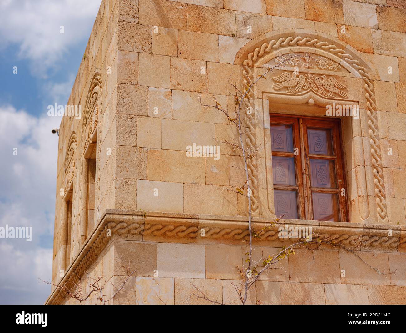 travel to city of Lindos on island of Rhodes, Greece. Details of streets of old town Lindos. Interesting elements of door, shutters, bas-relief of walls. tourist attraction on island of Rhodes Stock Photo