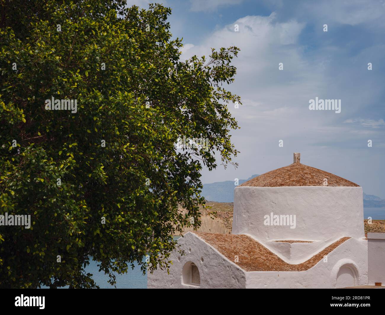 travel to city of Lindos on island of Rhodes, Greece. Details of streets of old town Lindos. Chapel of Saint George Pahimahiotis, 14-th century, in Lindos Stock Photo