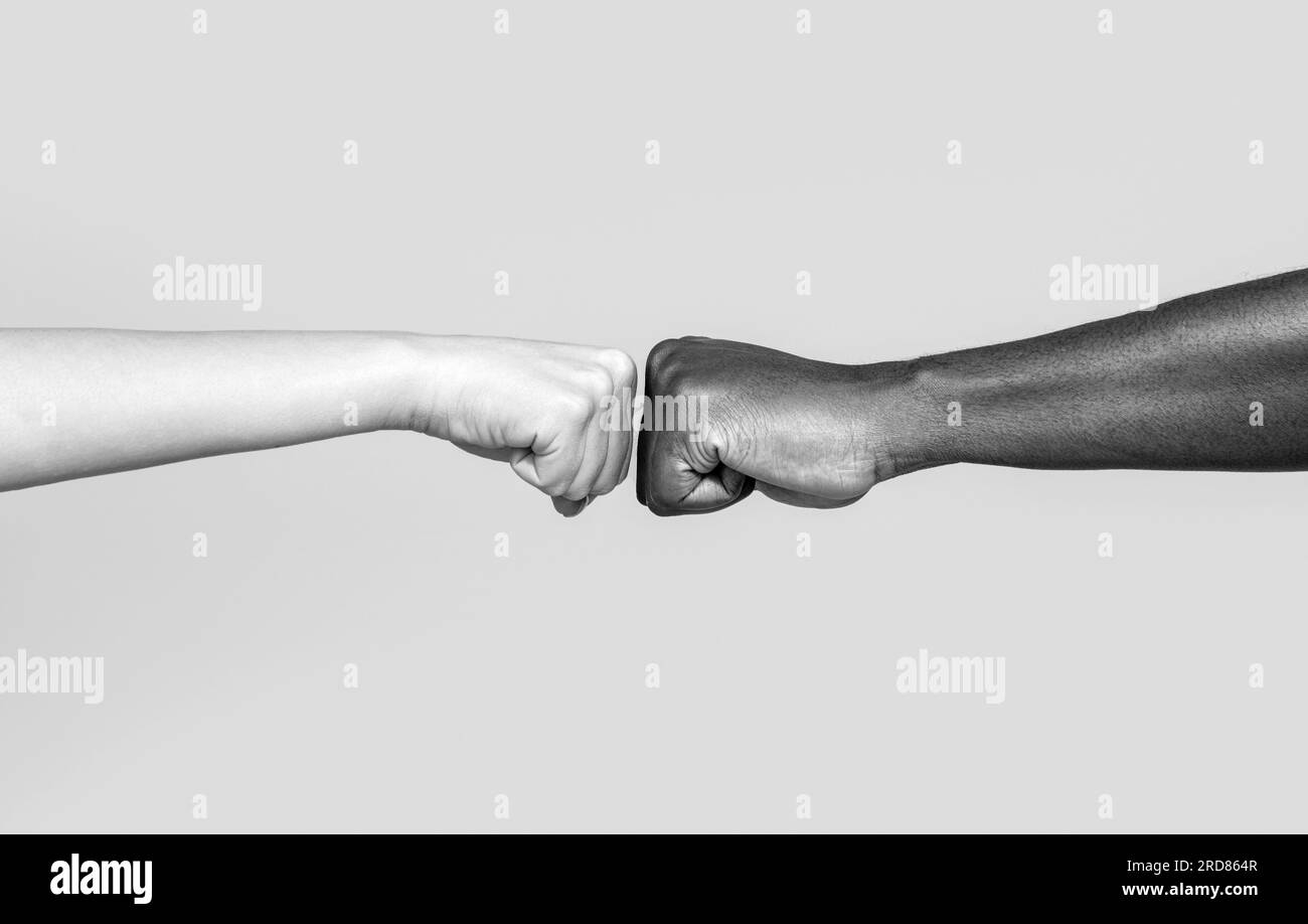 Black African American race male and woman hands giving a fist bump, multiracial diversity, immigration concept. Black and white Stock Photo