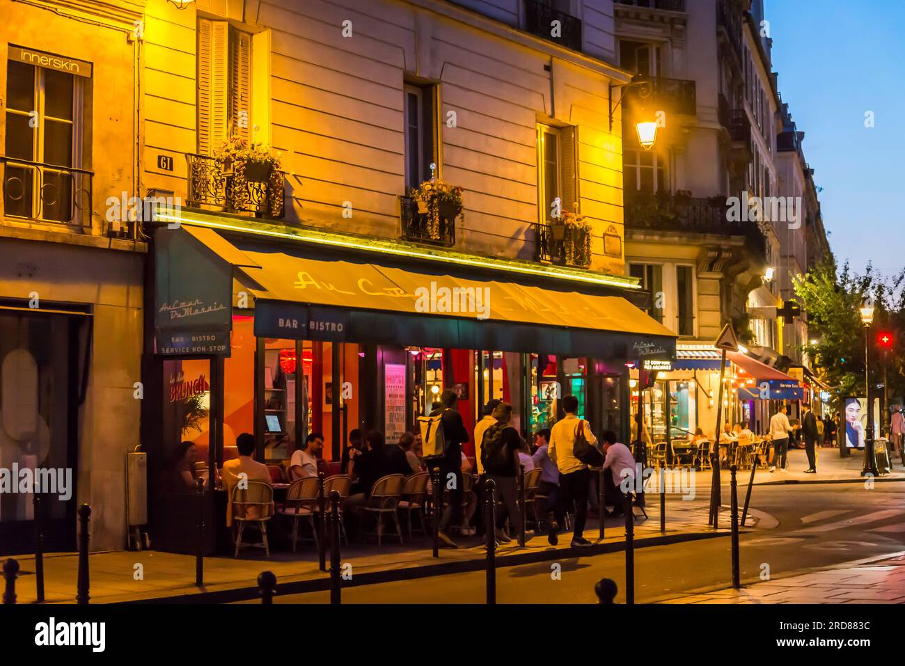 People sitting in an outdoor bar, Le Marais Neighborhood, Paris, France ...