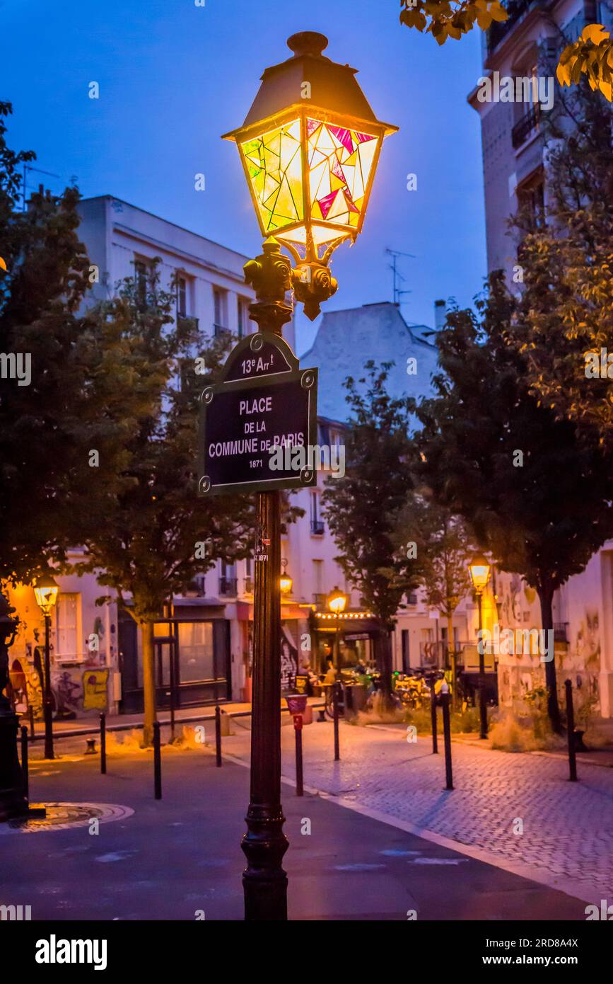 Paris Commune square and lit lantern in the popular 13th arrondissement, Paris, France Stock Photo
