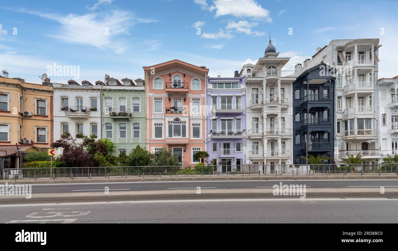 Colorful traditional residential buildings overlooking Bosphorus strait, in Arnavutkoy neighborhood, Besiktas district, Istanbul, Turkiye, in a sunny spring day Stock Photo