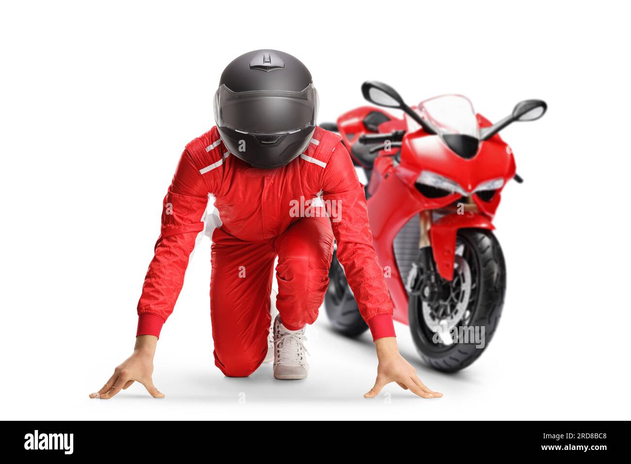 Motorbike racer in a set position preparing for a run isolated on white background Stock Photo