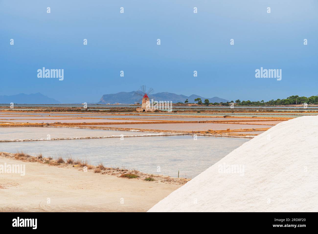 Windmill with pile of salt in the salt flats, Saline Ettore e Infersa, Marsala, province of Trapani, Sicily, Italy, Mediterranean, Europe Stock Photo