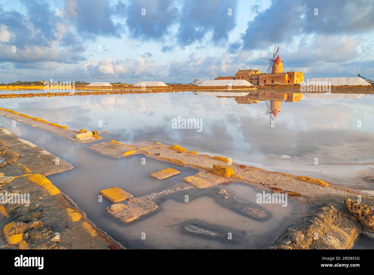 Reflection of the windmill in the salt flats at dawn, Saline Ettore e Infersa, Marsala, province of Trapani, Sicily, Italy, Mediterranean, Europe Stock Photo