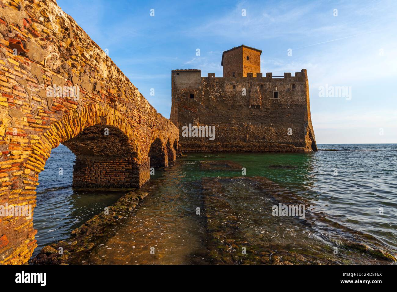 View from below of the arches of the bridge that link the Torre Astura castle with mainland, at sunset, Tyrrhenian Sea, Rome province, Latium (Lazio) Stock Photo