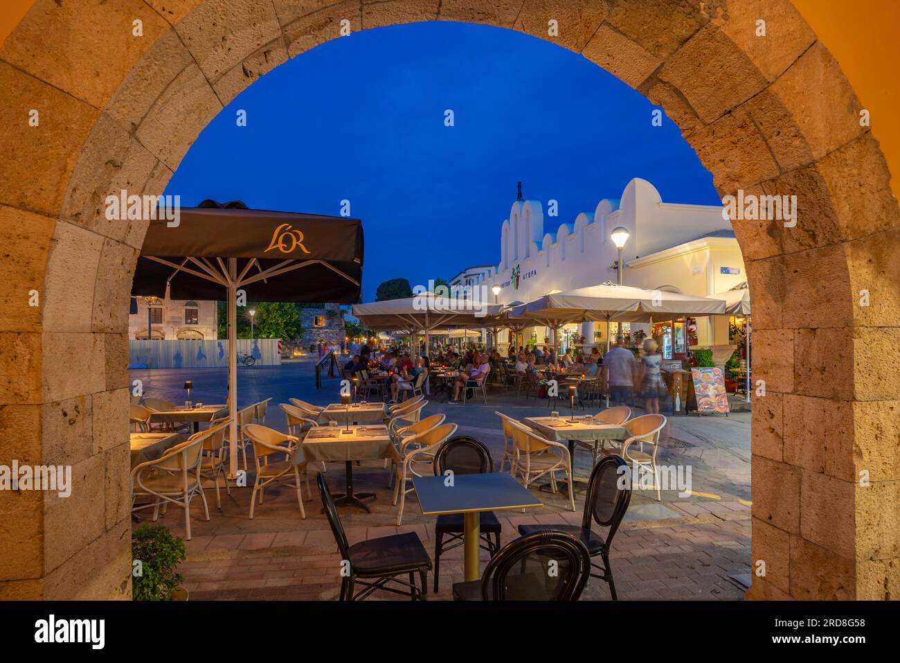 View of Kos Municipal Market in Eleftherias Central Square in Kos Town at dusk, Kos, Dodecanese, Greek Islands, Greece, Europe Stock Photo
