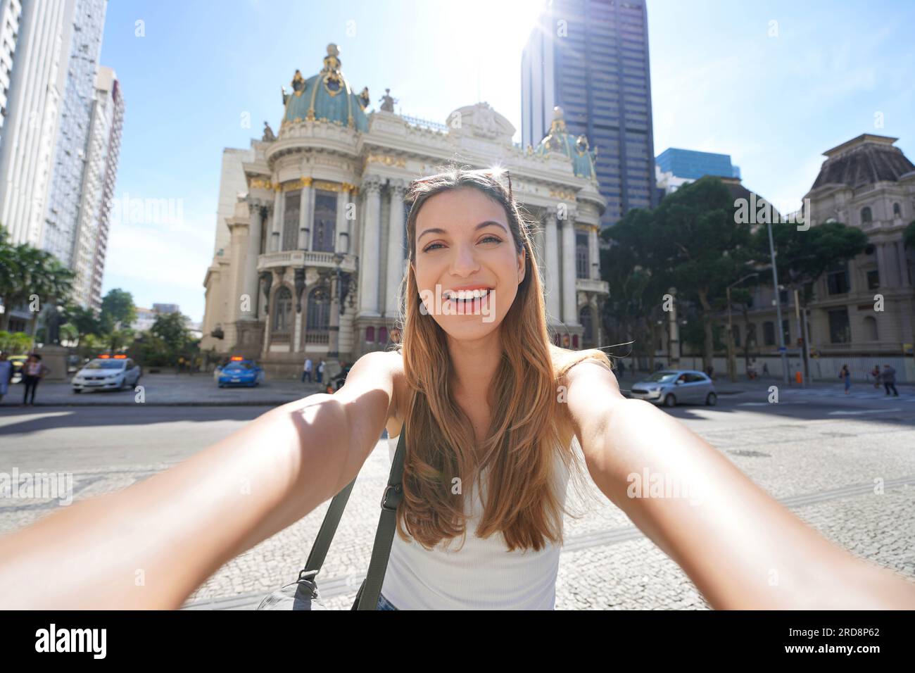 Brazilian young woman takes self portrait in front of the Municipal Theater of Rio de Janeiro, Brazil Stock Photo