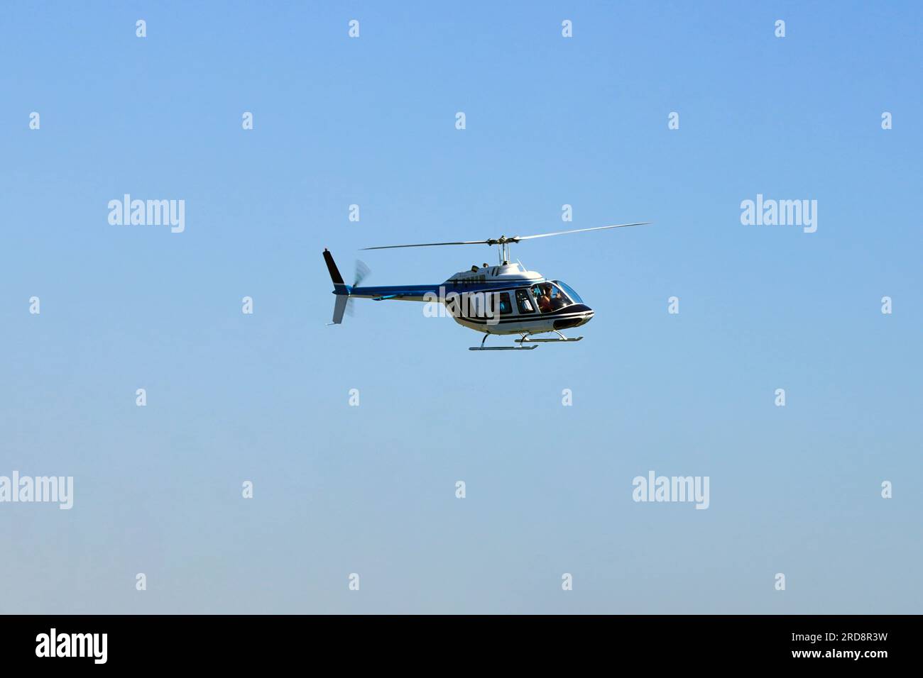 Helicopter in flight for sightseeing. Luxury lifestyle vacation. Tour on helicopter. Stock Photo