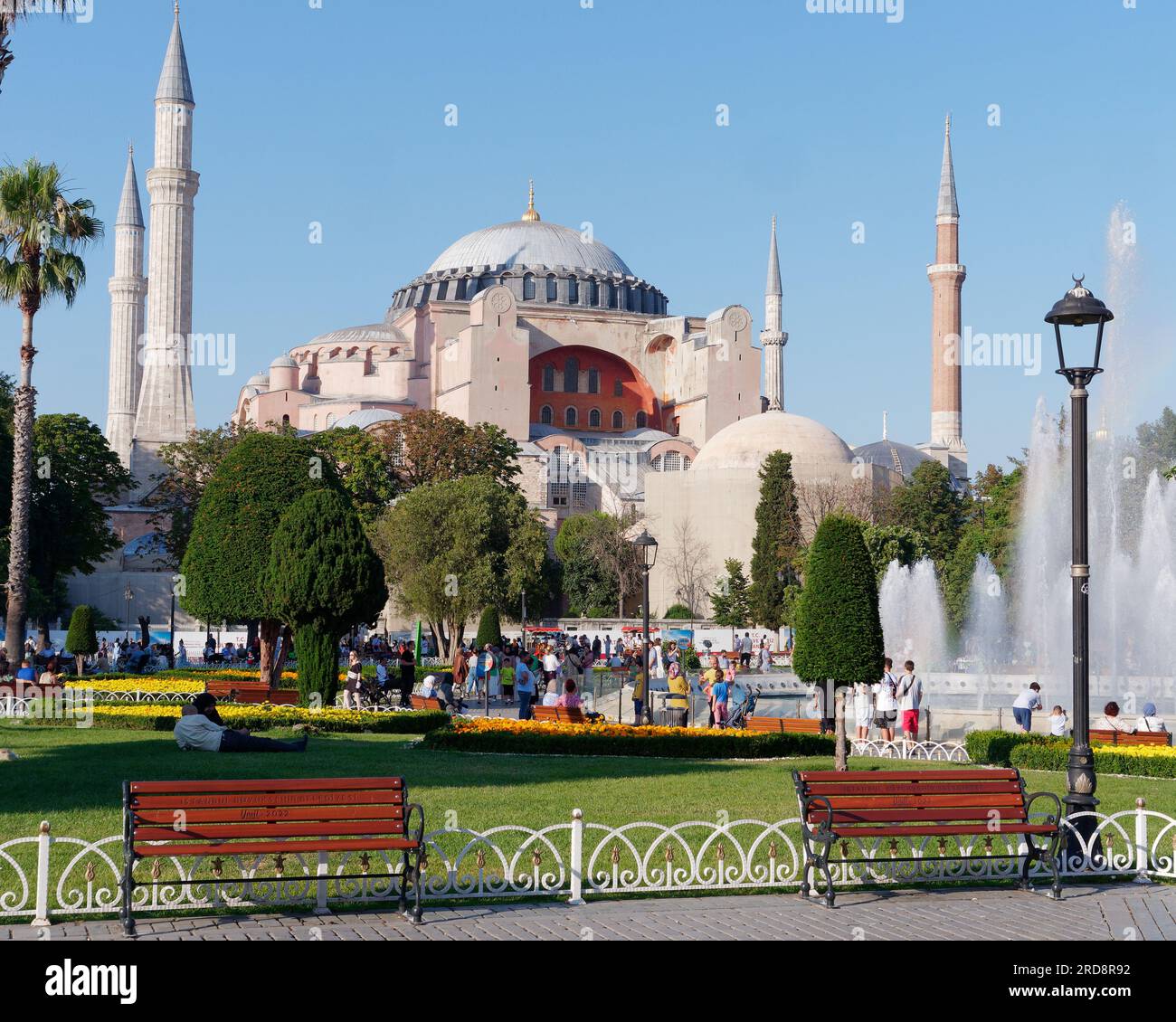 People enjoying Sultanahmet Park on a summers evening with the Hagia ...