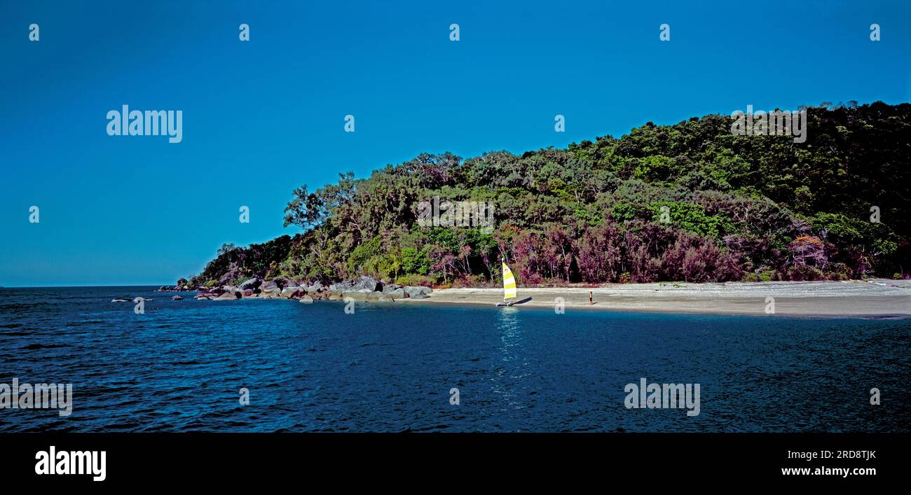 Australia. Queensland. Great Barrier Reef. Beach & sailboat. Wheeler Island. Family Islands Group. Stock Photo
