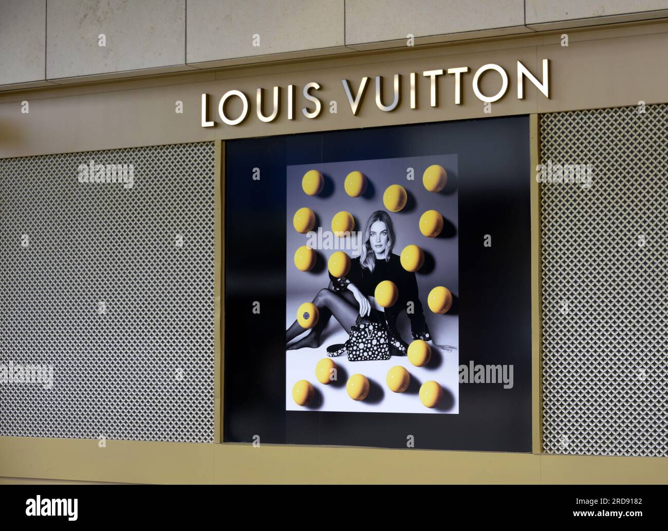 manchester louis vuitton designer exclusive expensive label fashion clothes  worker cleaner man retail brand logo design company Stock Photo - Alamy