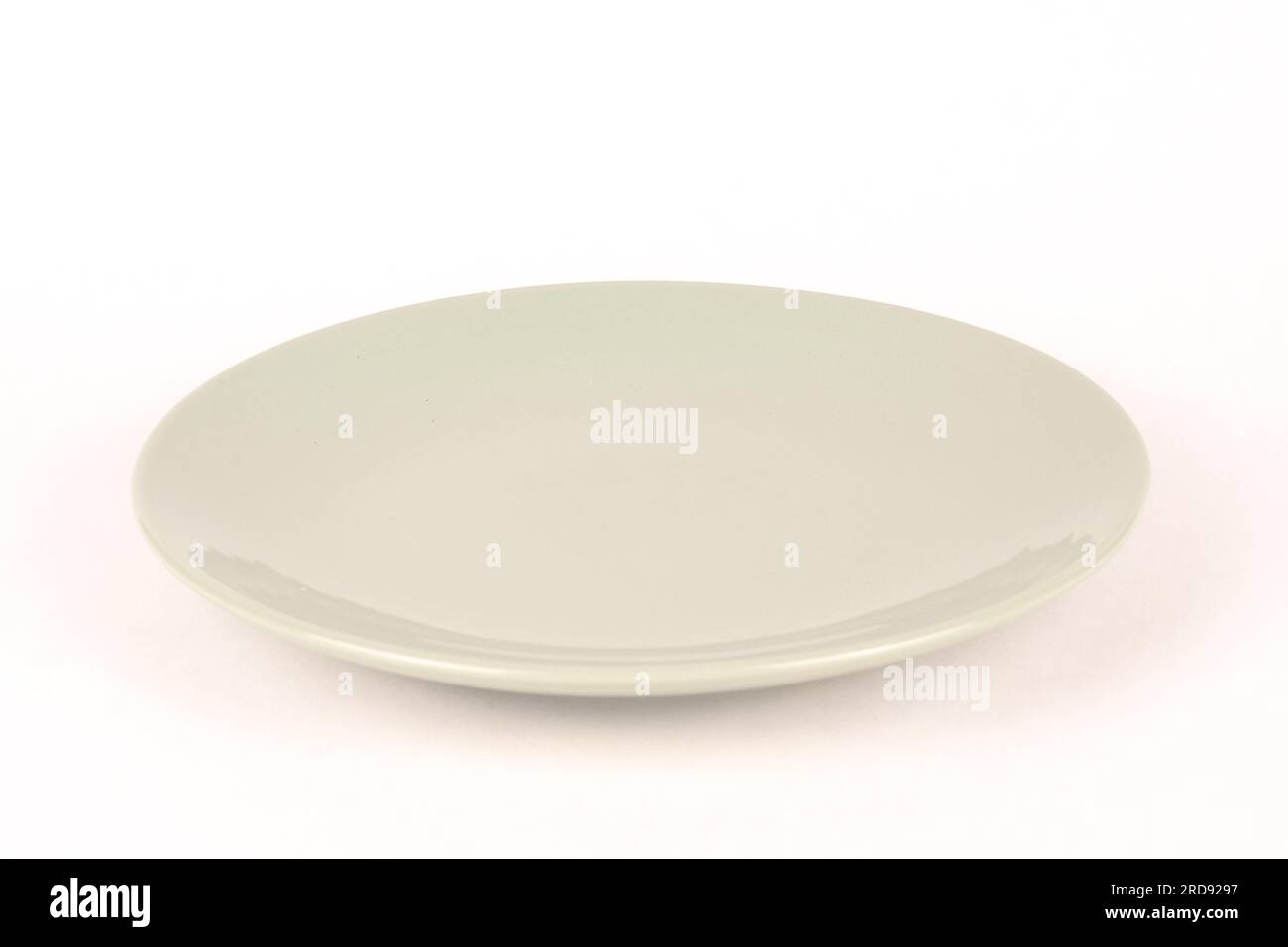 Empty gray green glass plate white background Stock Photo