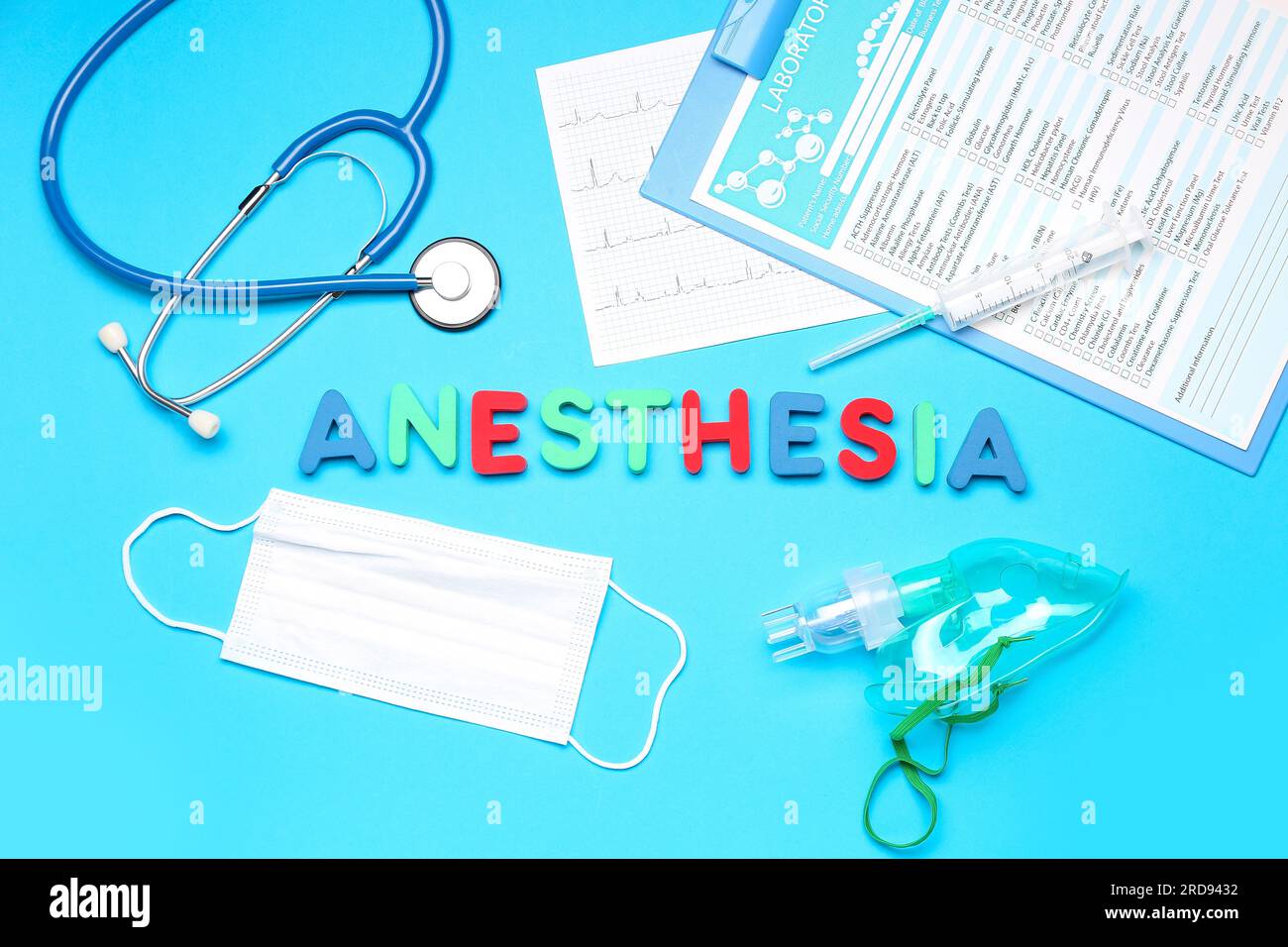 Word ANESTHESIA with medical supplies on blue background Stock Photo