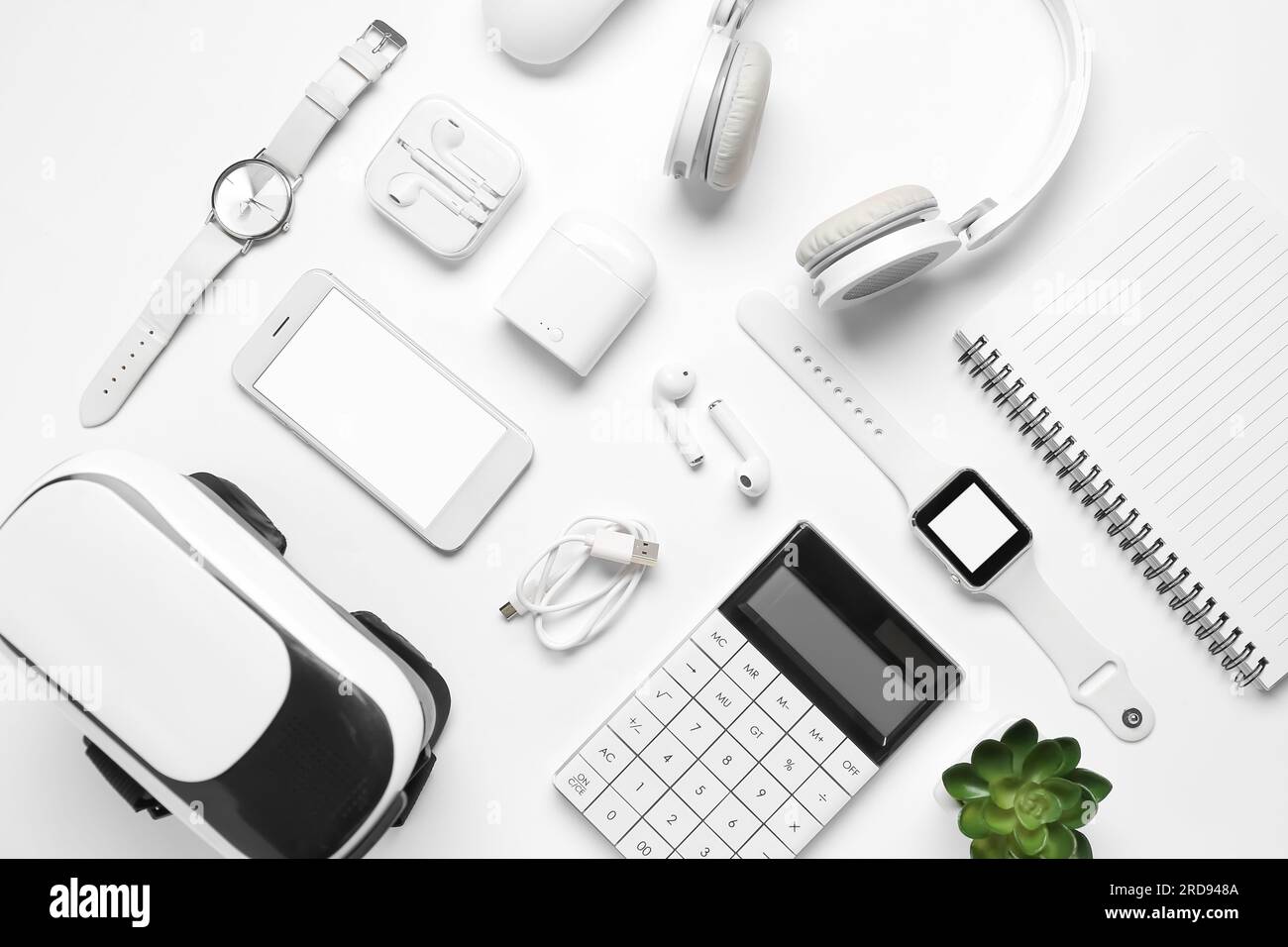 Composition with modern gadgets and notebook on white background Stock Photo