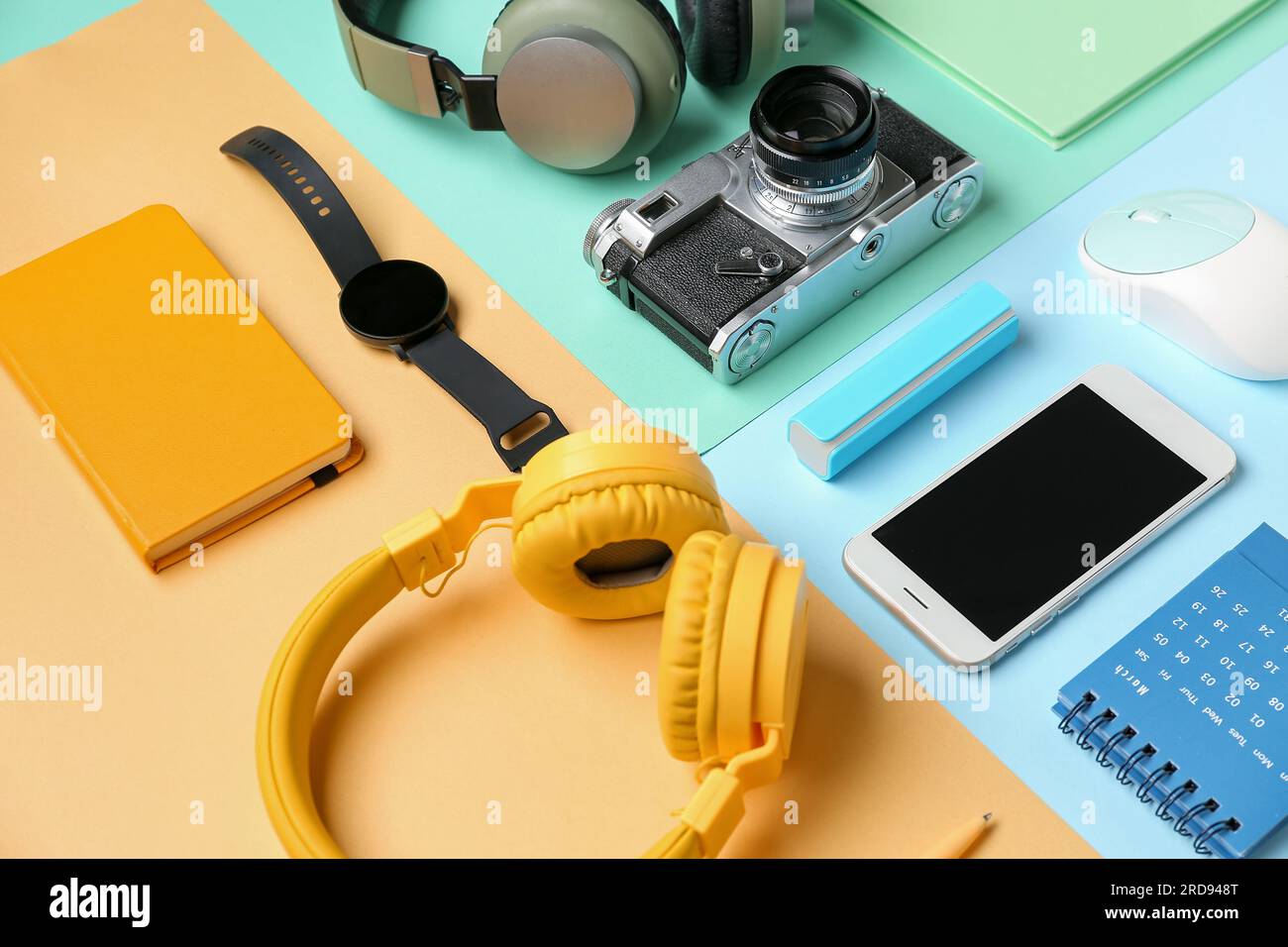 Composition with different gadgets and stationery on color background Stock Photo