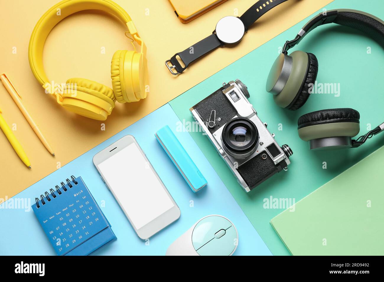 Composition with different gadgets and stationery on color background Stock Photo