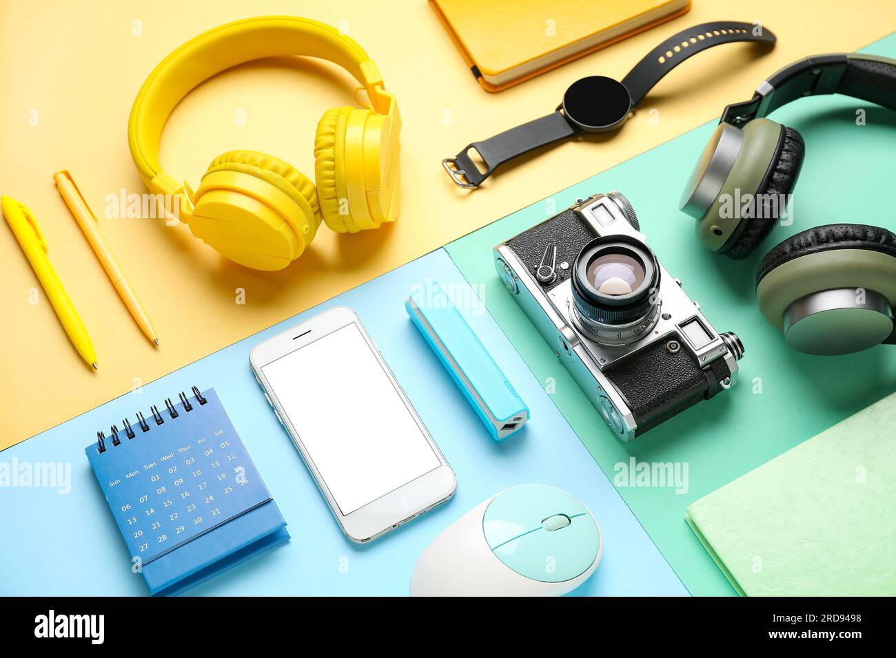 Composition with different gadgets and stationery on color background Stock Photo