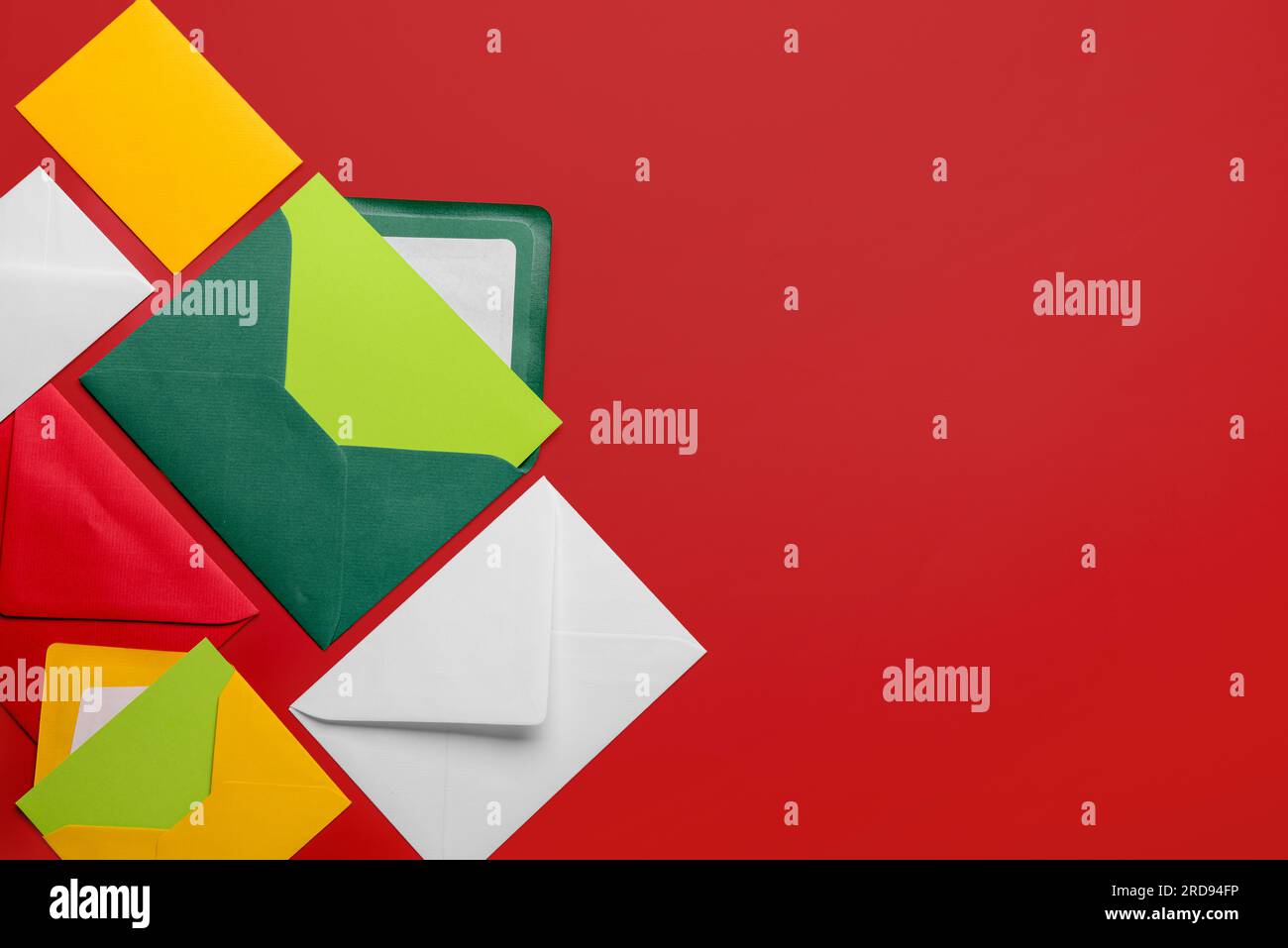 Composition with different envelopes and blank cards on red background Stock Photo