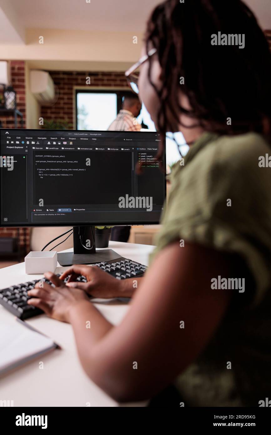 African american student learning programming writing source code while ...