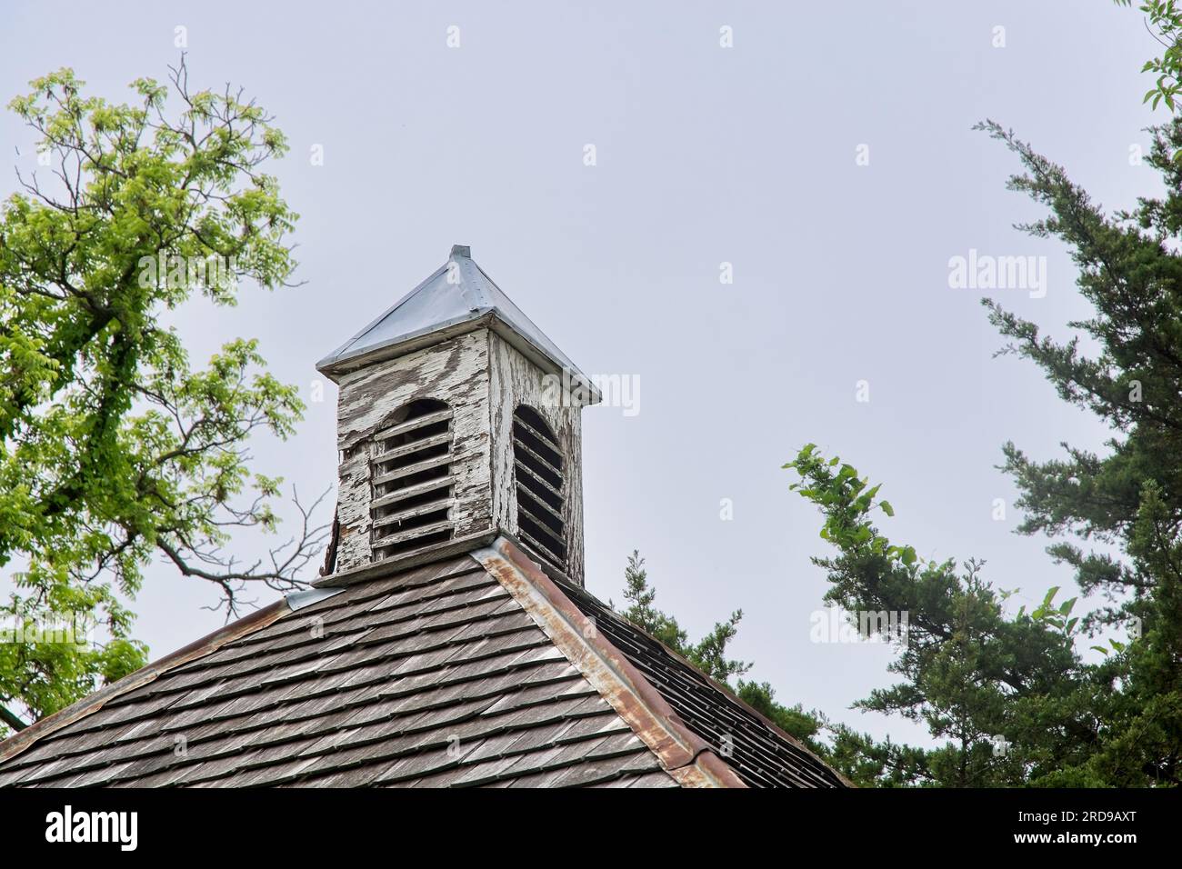 Weathered wooden cupola sits atop cedar shingled roof Stock Photo Alamy