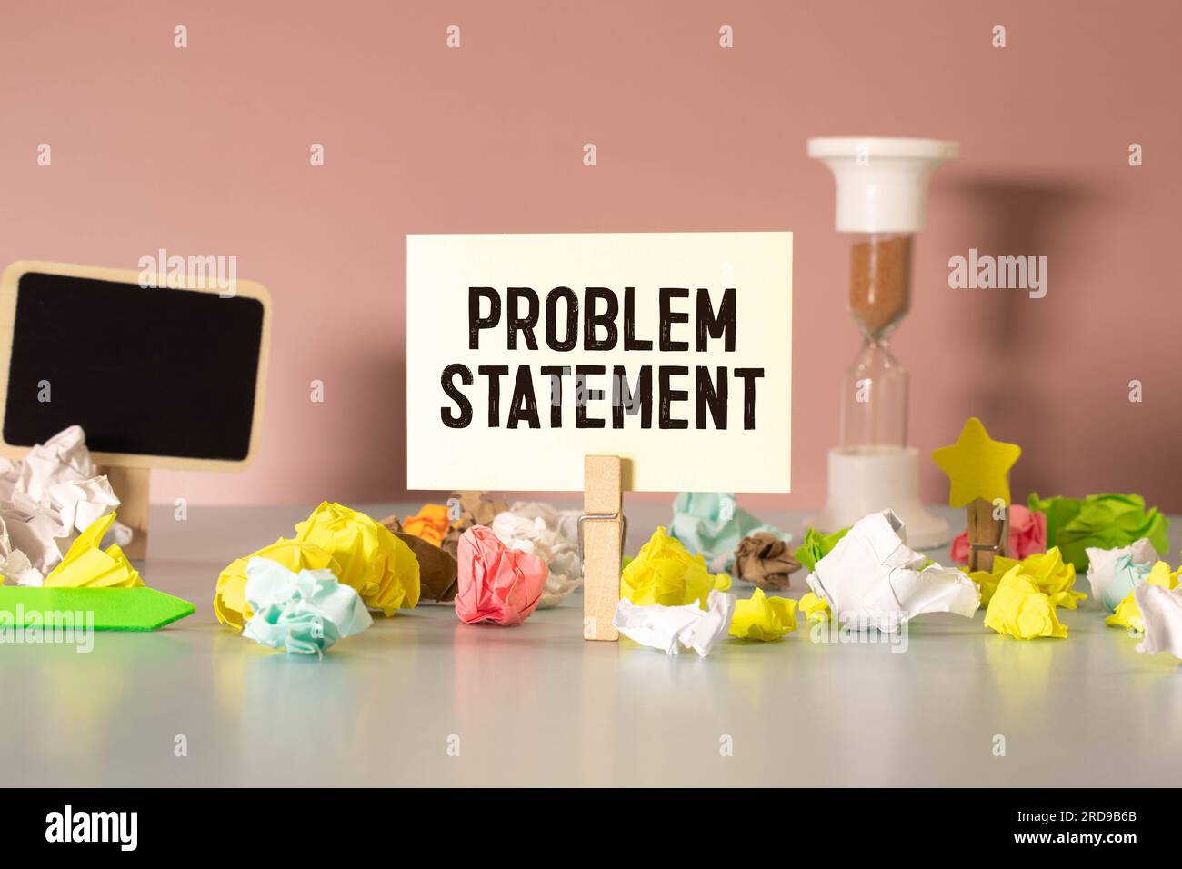 wooden cubes are scattered near the notepad with text. problem ...