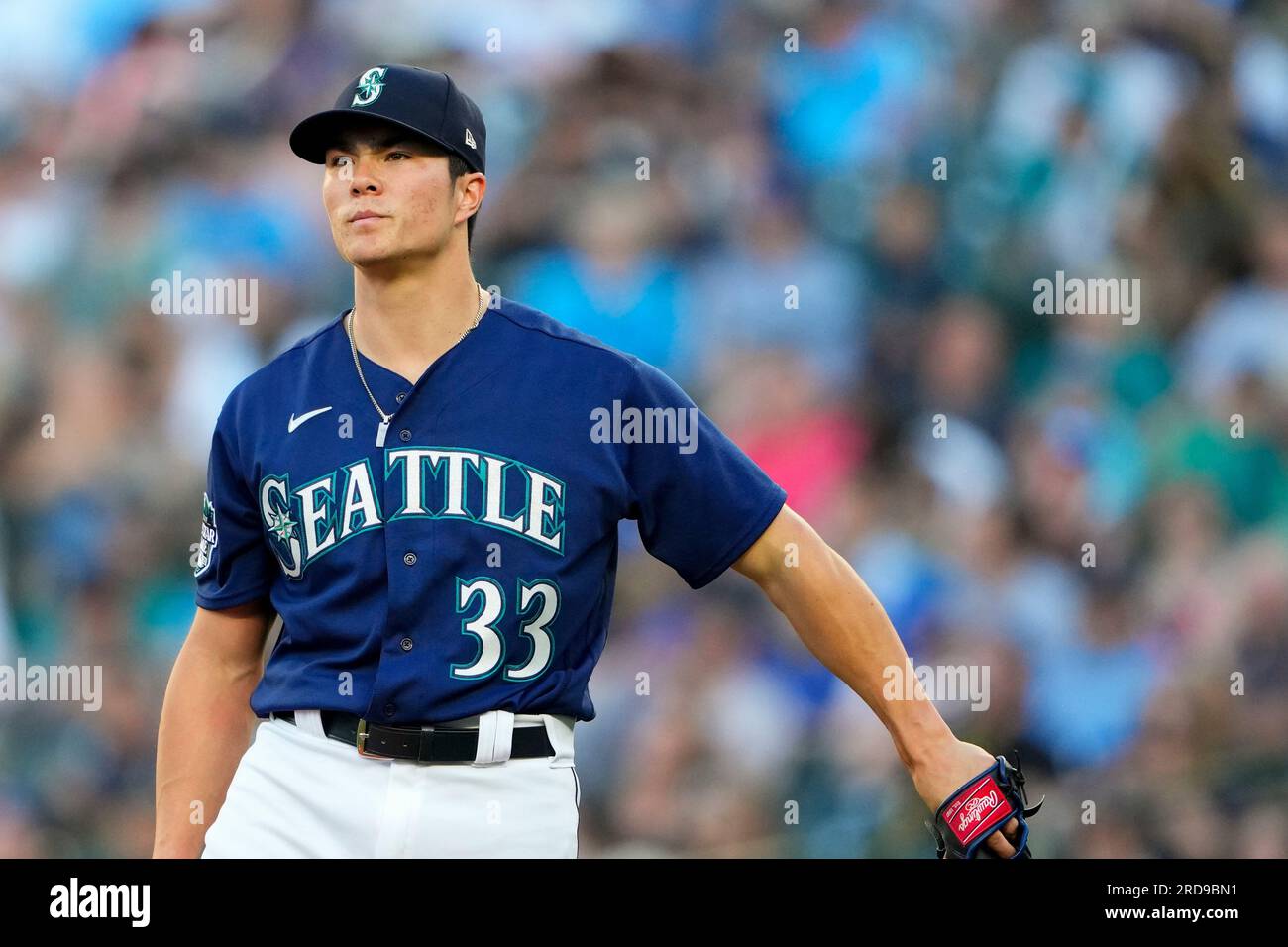 Seattle Mariners starting pitcher Bryan Woo reacts after giving up a
