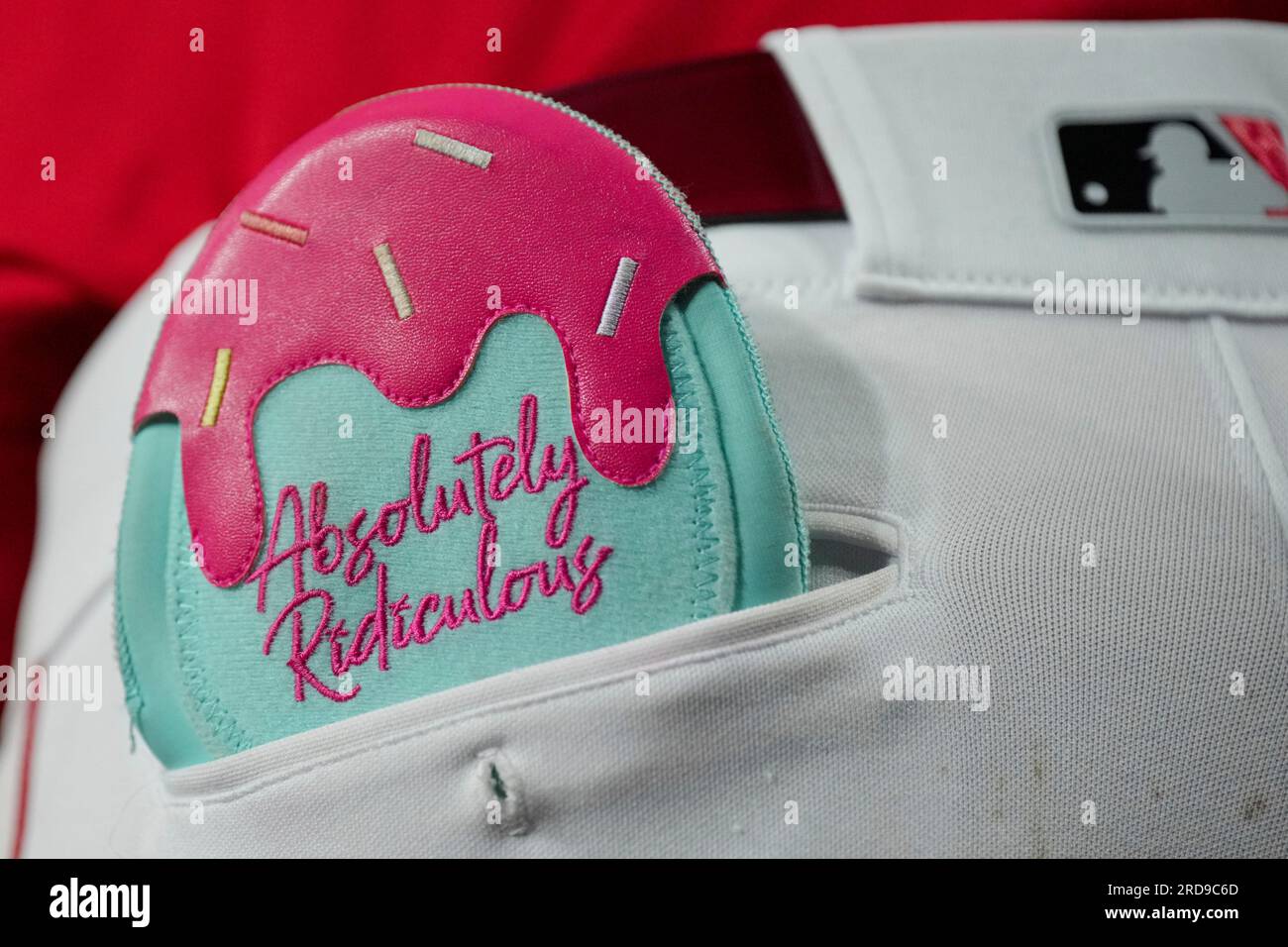 The sliding glove of Cincinnati Reds' Elly De La Cruz is seen as he