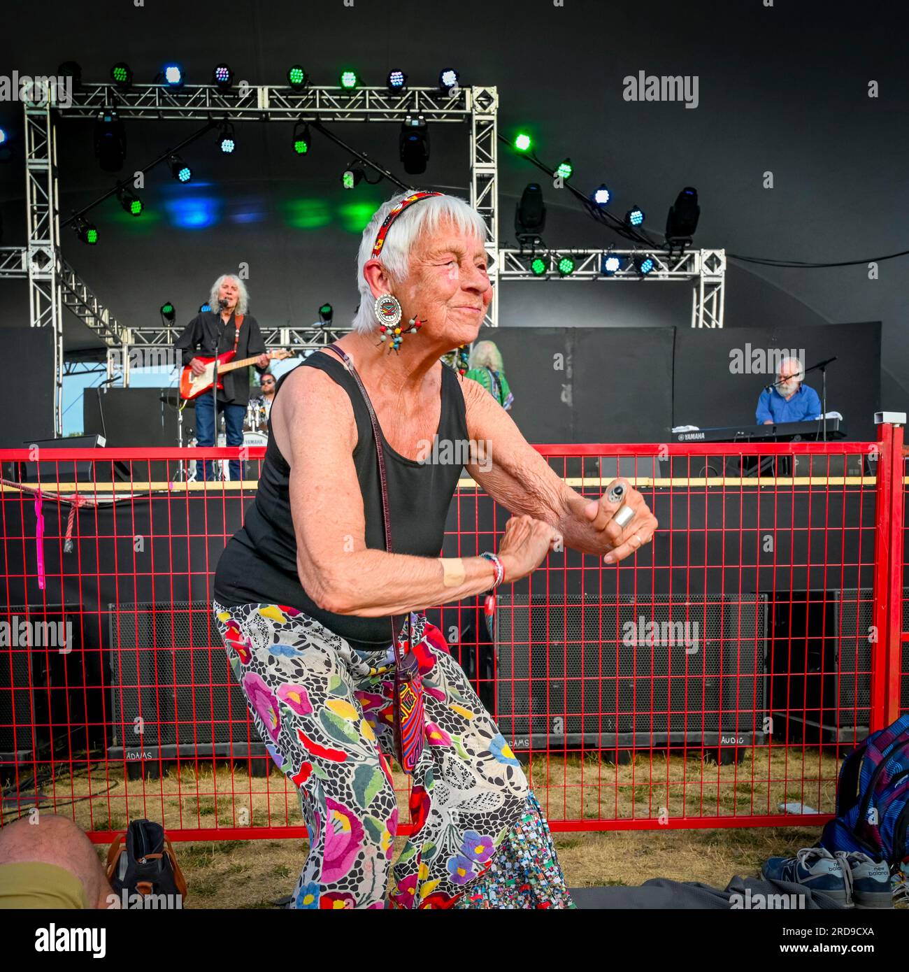 OAP elderly woman dancing at music festival Stock Photo