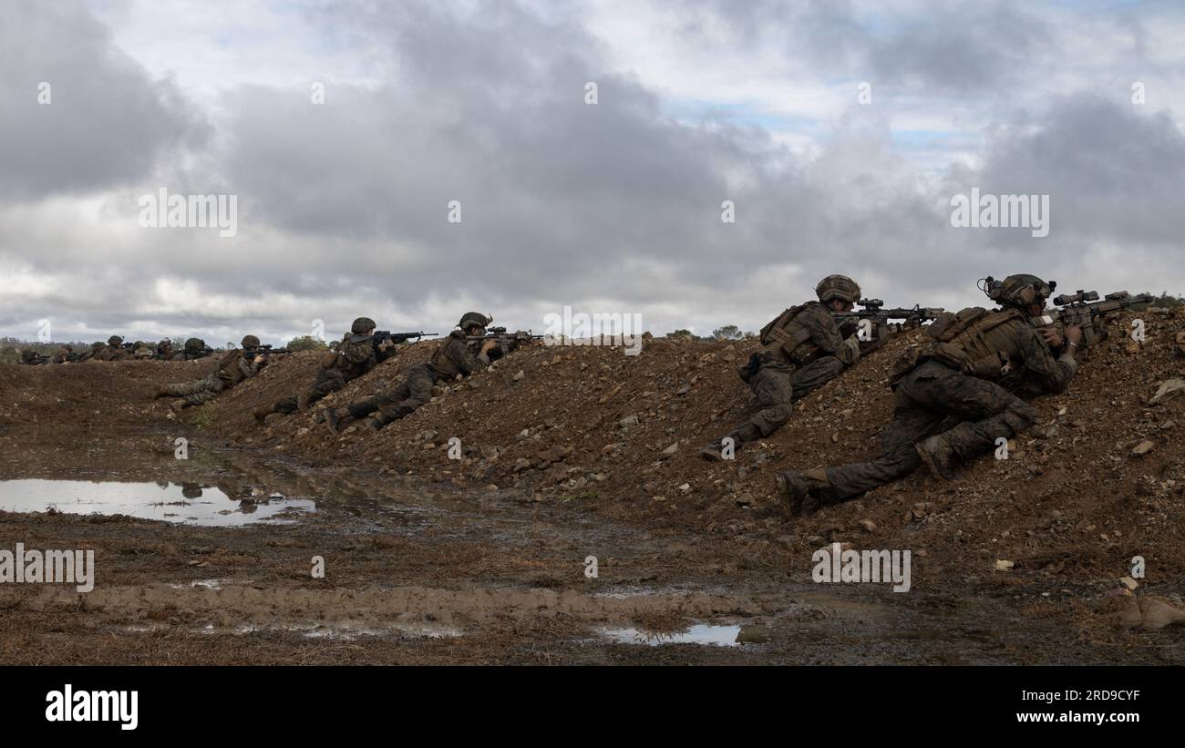 U.S. Marines with Marine Medium Tiltrotor Squadron 265 (Rein.) and Battalion Landing Team 2/1, both with the 31st Marine Expeditionary Unit, post security during a simulated counter attack on a forward arming and refueling point at Shoalwater Bay Training Area, July 5, 2023. The counter attack tested the reaction time and tactical ability of bulk fuel specialists with VMM-265 (Rein.), in coordination with BLT 2/1 Marines, 31st MEU, to respond to enemy fire within an expeditionary advanced base of operations. The 31st MEU is operating aboard ships of the America Amphibious Ready Group in the 7t Stock Photo