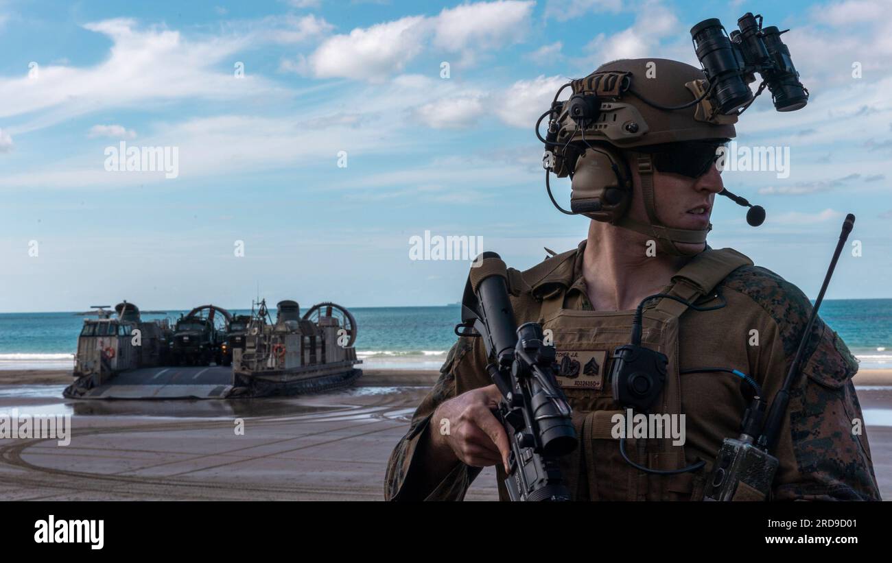 U.S. Marine Corps Sgt. Joseph Dutcher, an explosive ordnance disposal technician with Combat Logistics Battalion 31, 31st Marine Expeditionary Unit, observes his surroundings after disembarking a landing craft air cushion before a simulated motorized raid at Camp Growl, Queensland, Australia, July 2, 2023. A motorized raid utilizes multiple tactical vehicles to place Marines in strategic positions while providing suppressive fire to secure austere terrain. The 31st MEU is operating aboard ships of USS America Amphibious Ready Group in the 7th fleet area of operations to enhance interoperabilit Stock Photo