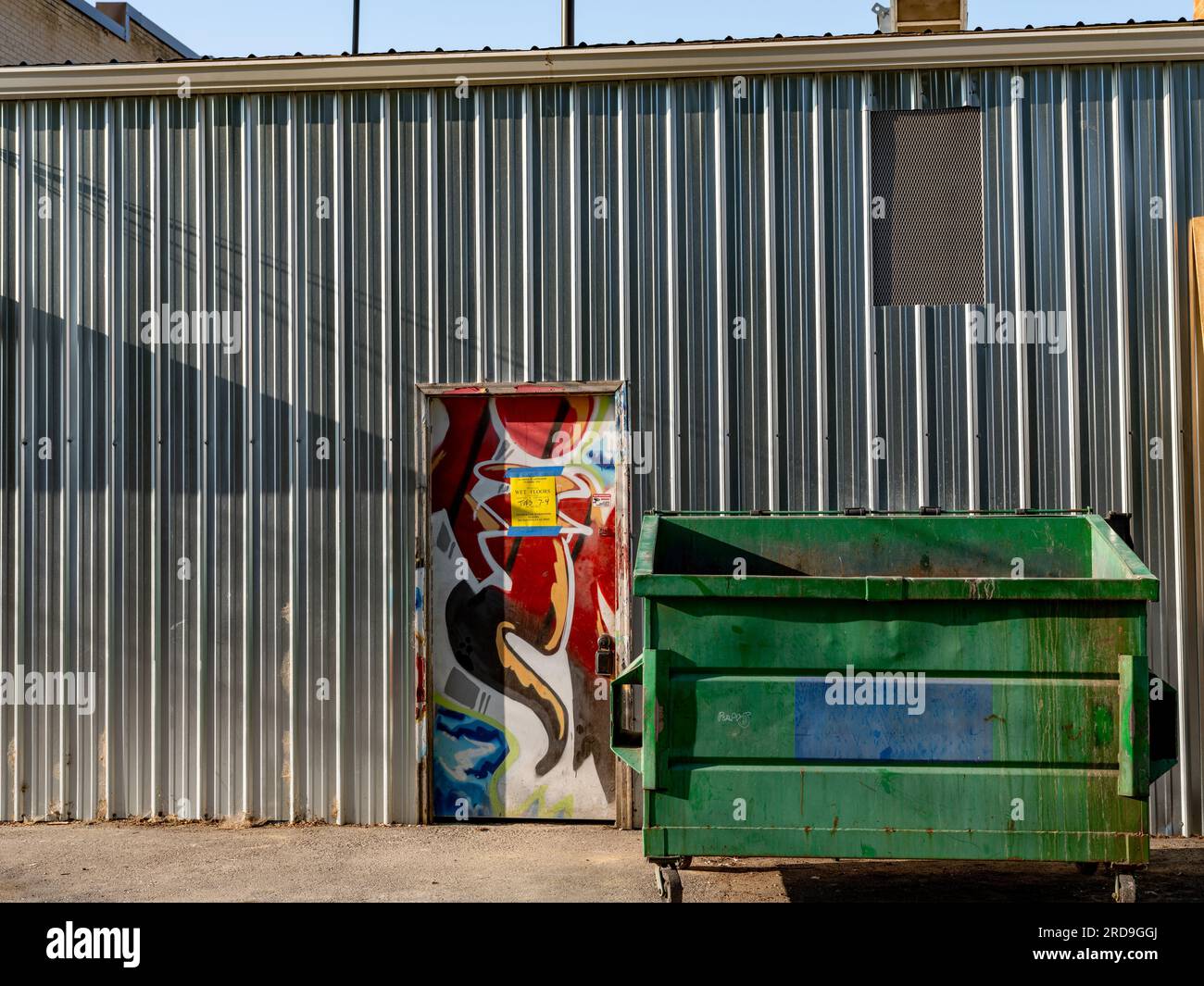 Back Alley Painted Door With A Sign And Dumpster Stock Photo Alamy