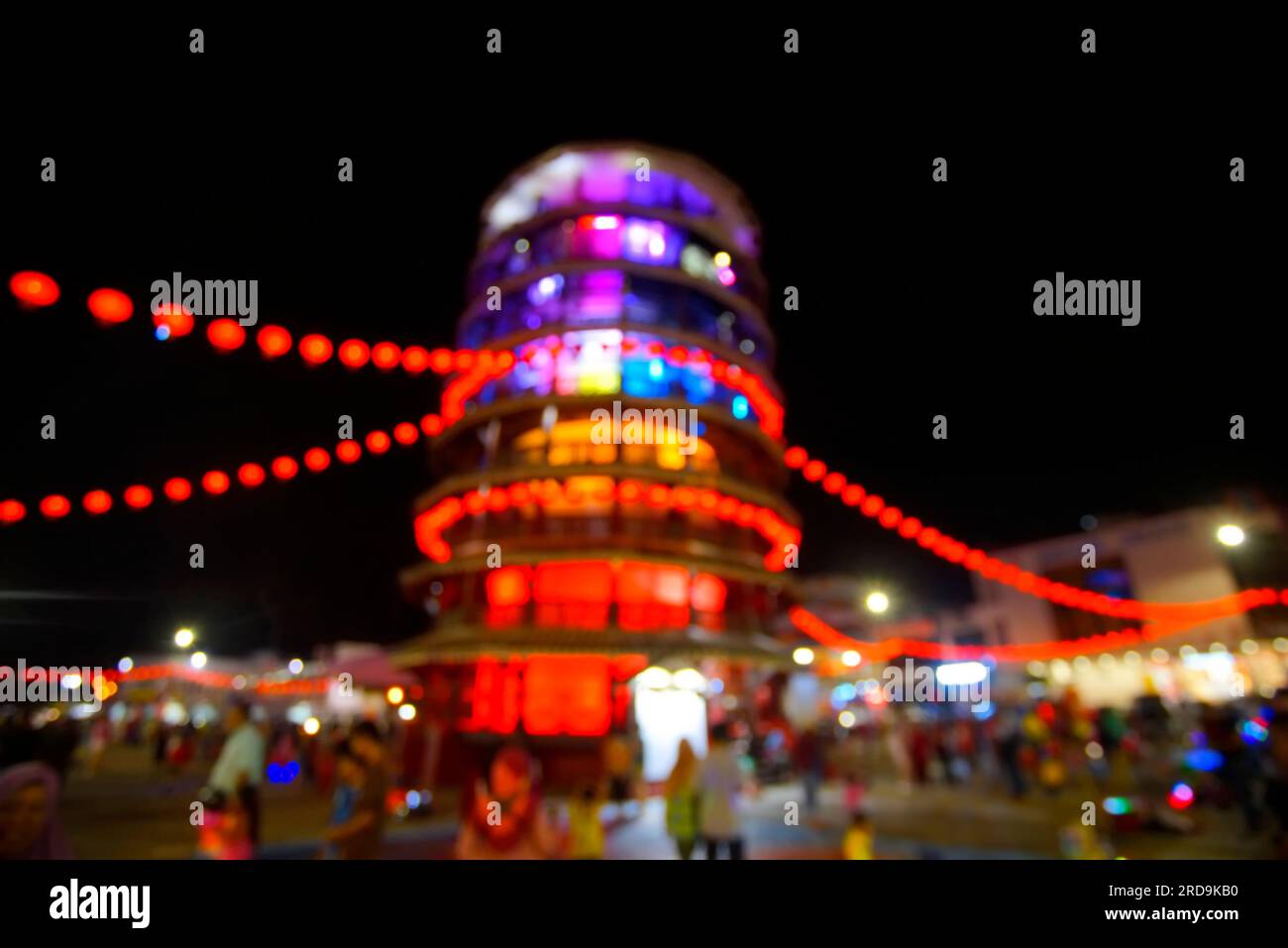 Blur Image of The leaning tower of Teluk Intan or 'menara condong' decorated with red lanterns during the celebration of Chinese New Year. Stock Photo