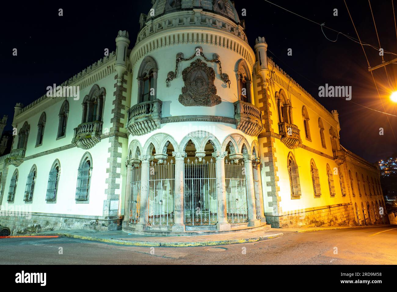 Tegucigalpa, Francisco Morazan, Honduras - December 11, 2022: Former Presidential House with Empty Street in Downtown City at Night Stock Photo
