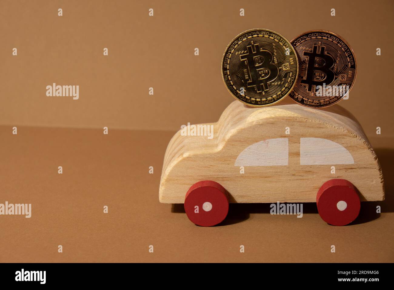 Bitcoin gold coin with wooden toy car. Saving and manage money for transport car loan mining trading concept. Automotive transportation industry merge with technology exchange financial market can pay money to seller online in blockchain. BTC Cryptocurrency or crypto digital payment system. Digital coin money farm in digital cyberspace Stock Photo