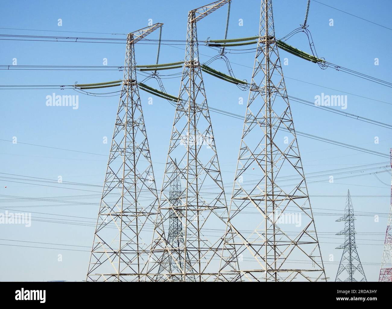 A transmission tower, electricity pylon which is a tall steel lattice structure that used to support overhead high voltage power lines, high voltage e Stock Photo
