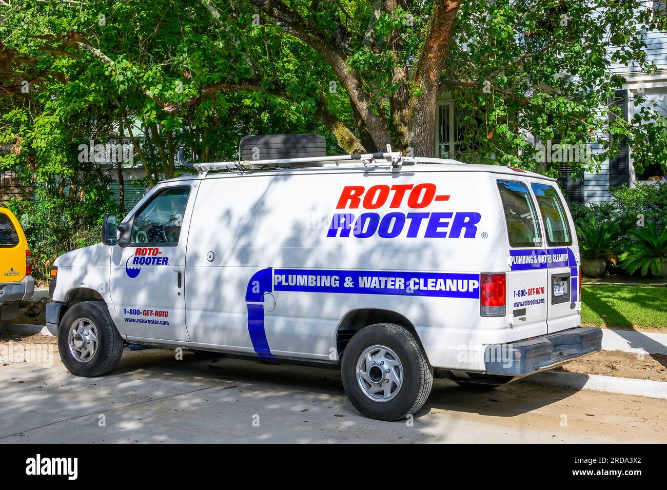 NEW ORLEANS, LA, USA - JULY 19, 2023: Roto-Rooter service van in an Uptown neighborhood Stock Photo
