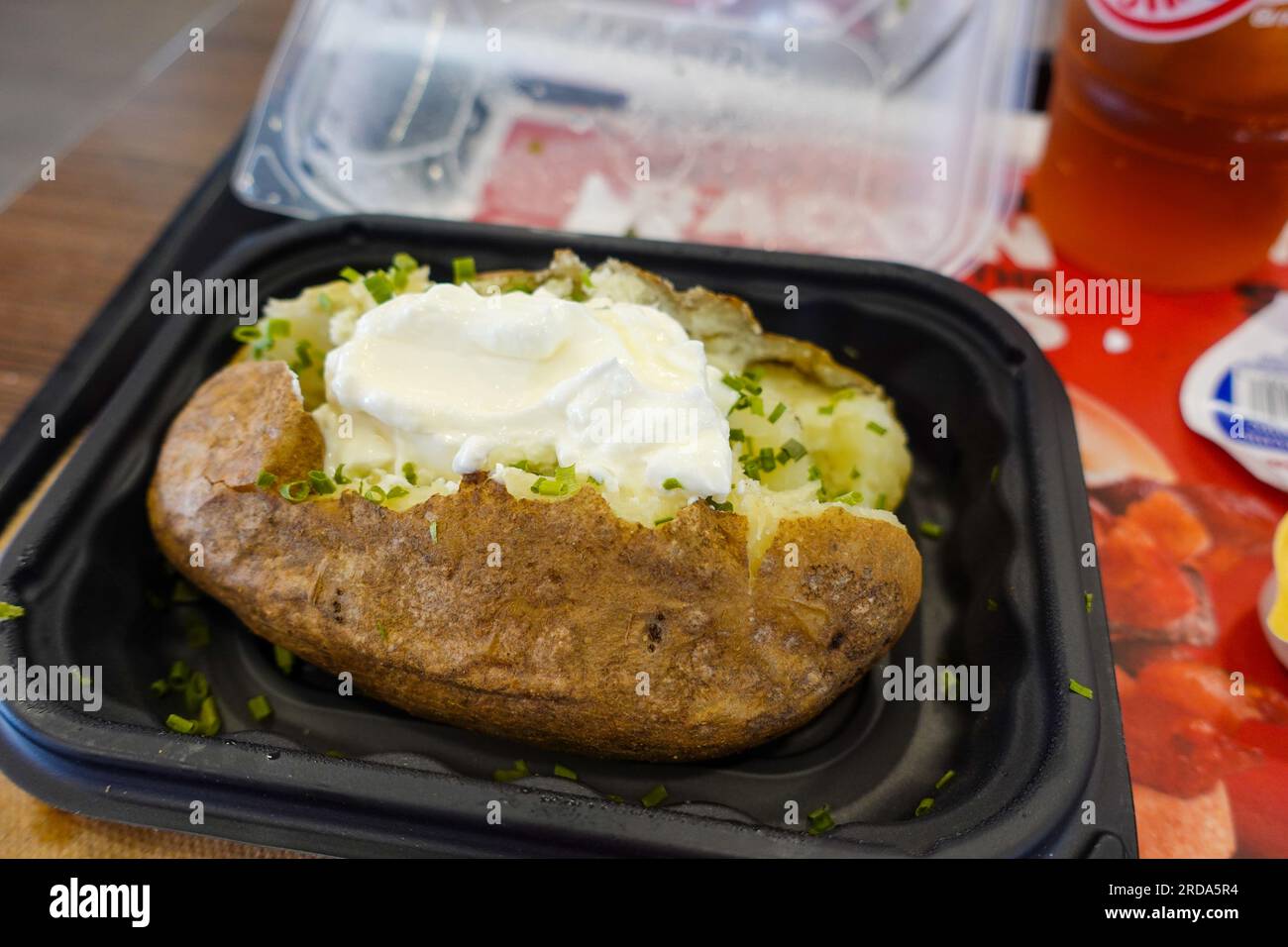 Wendy's fast food restaurant hot baked potato with sour cream Stock