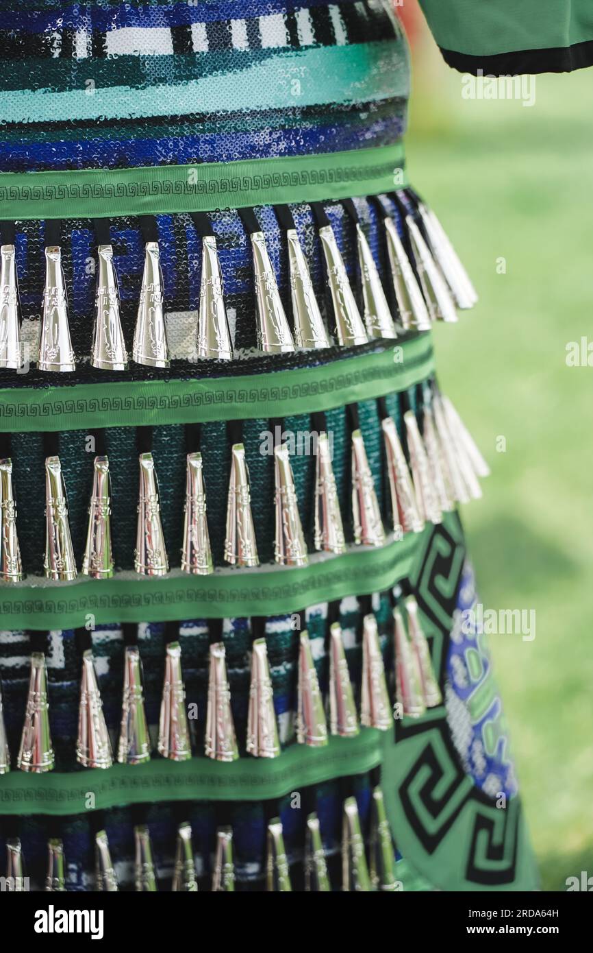 close up of decorative metal cones on a jingle dress worn by an