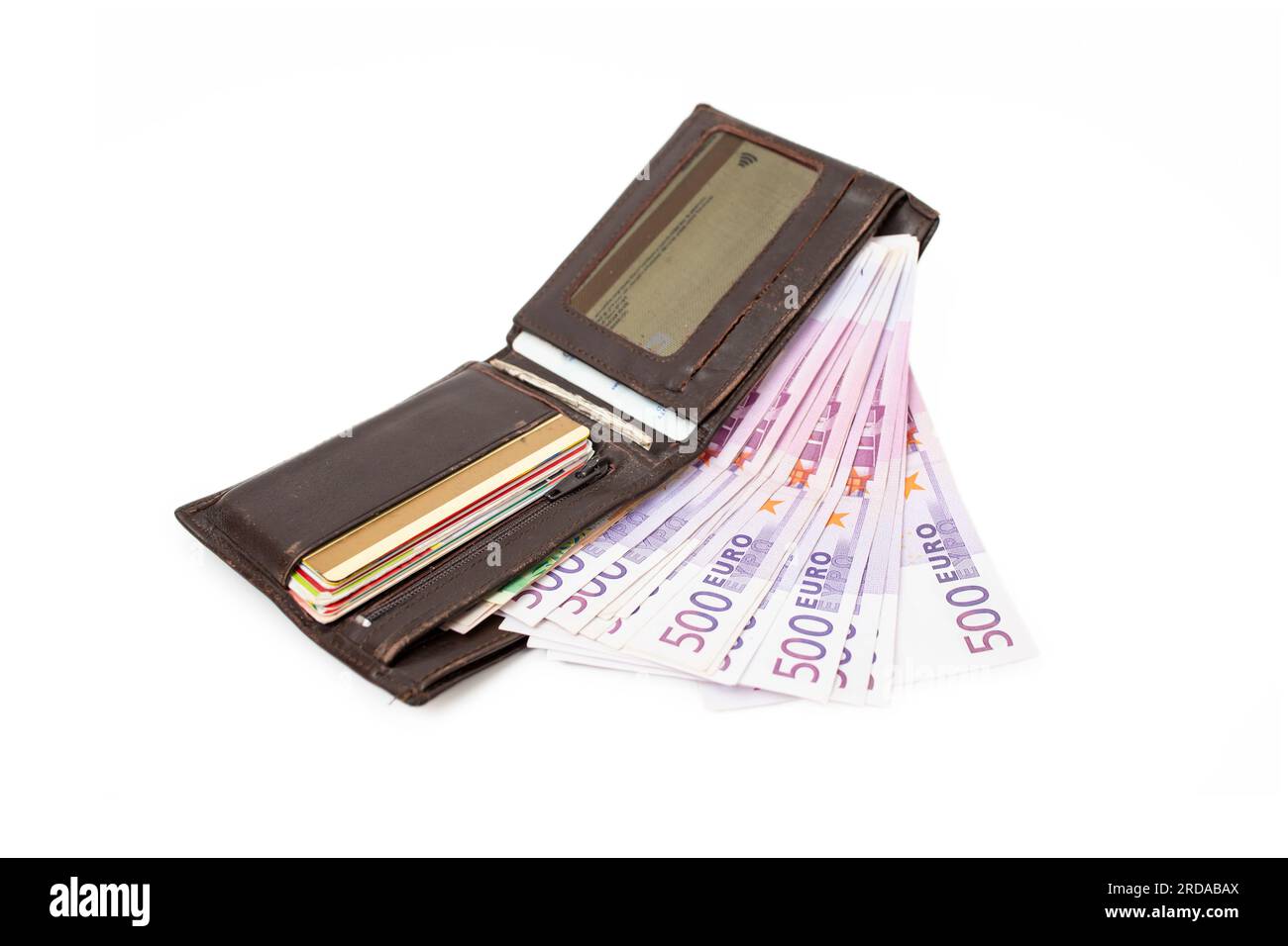 500 euro paper banknotes in a opened brown leather wallet, isolated on white background. Stock Photo