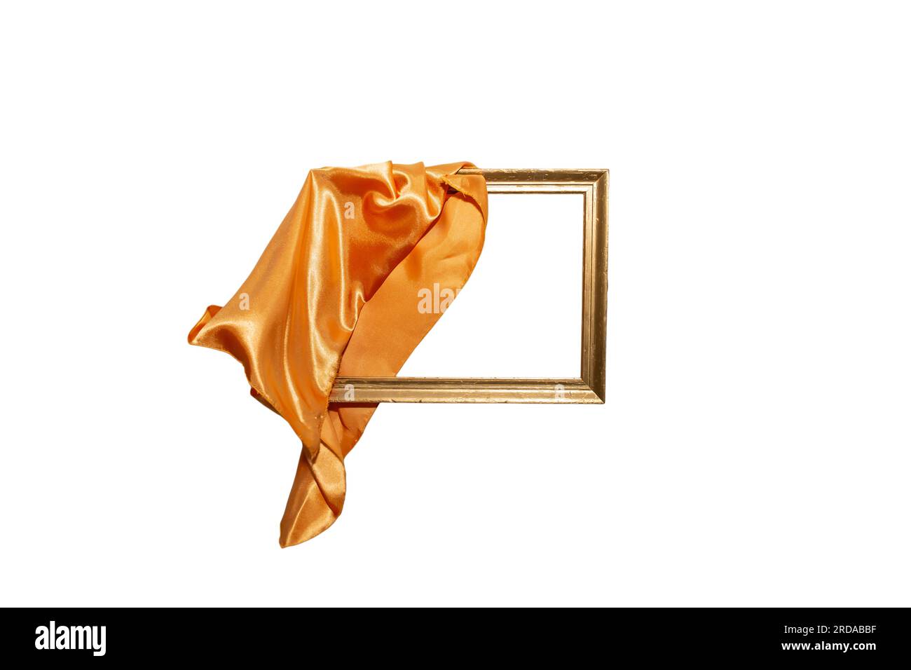 Flying orange satin cloth unveiling golden frame, abstract new product launch backdrop with motion blur Stock Photo