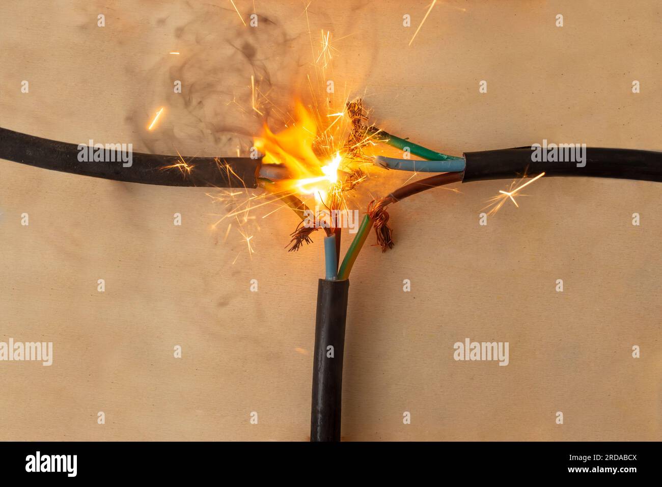 flame smoke and sparks on three electrical cables faulty connection, on