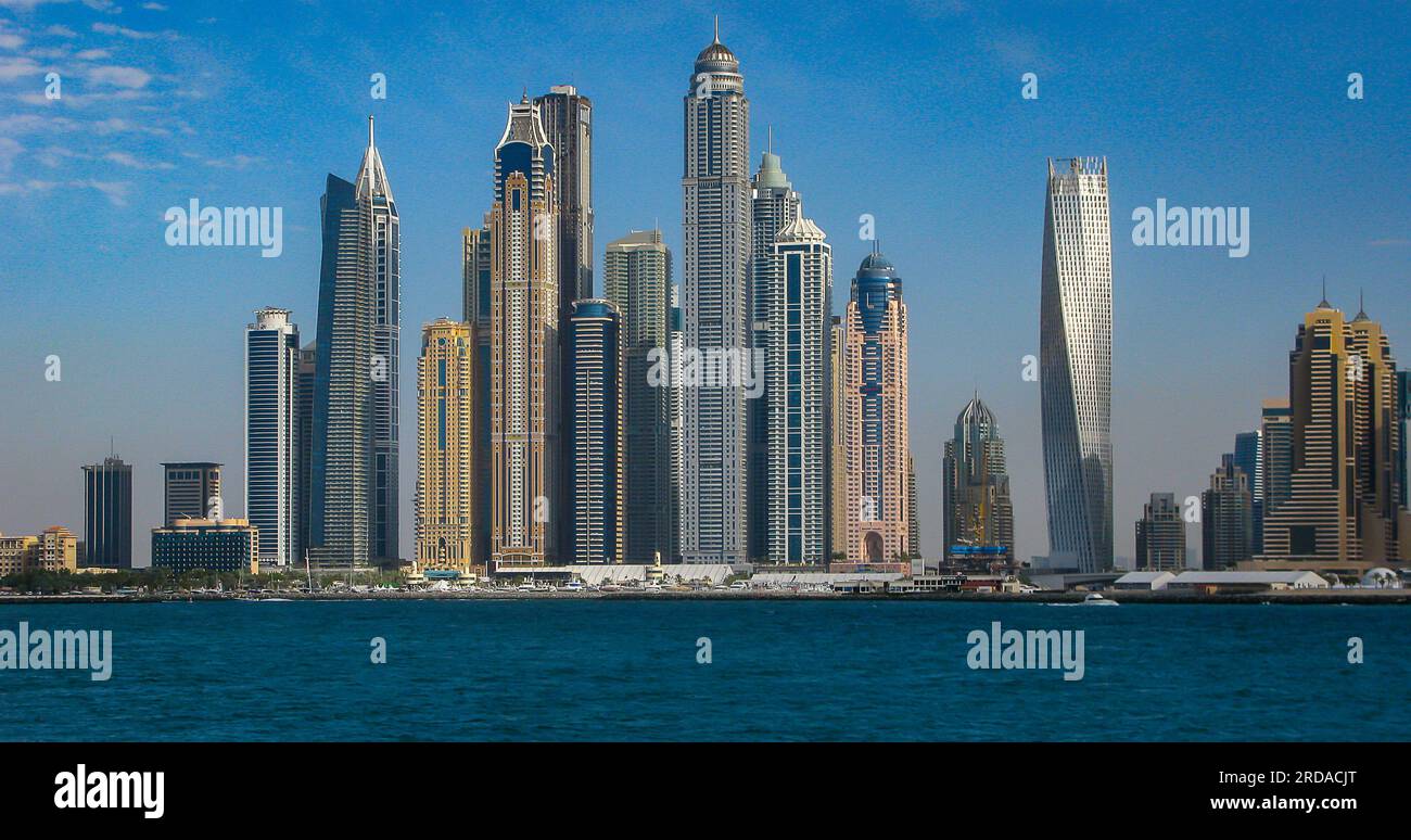 view of the beach and skyscrapers from the promenade of the artificial