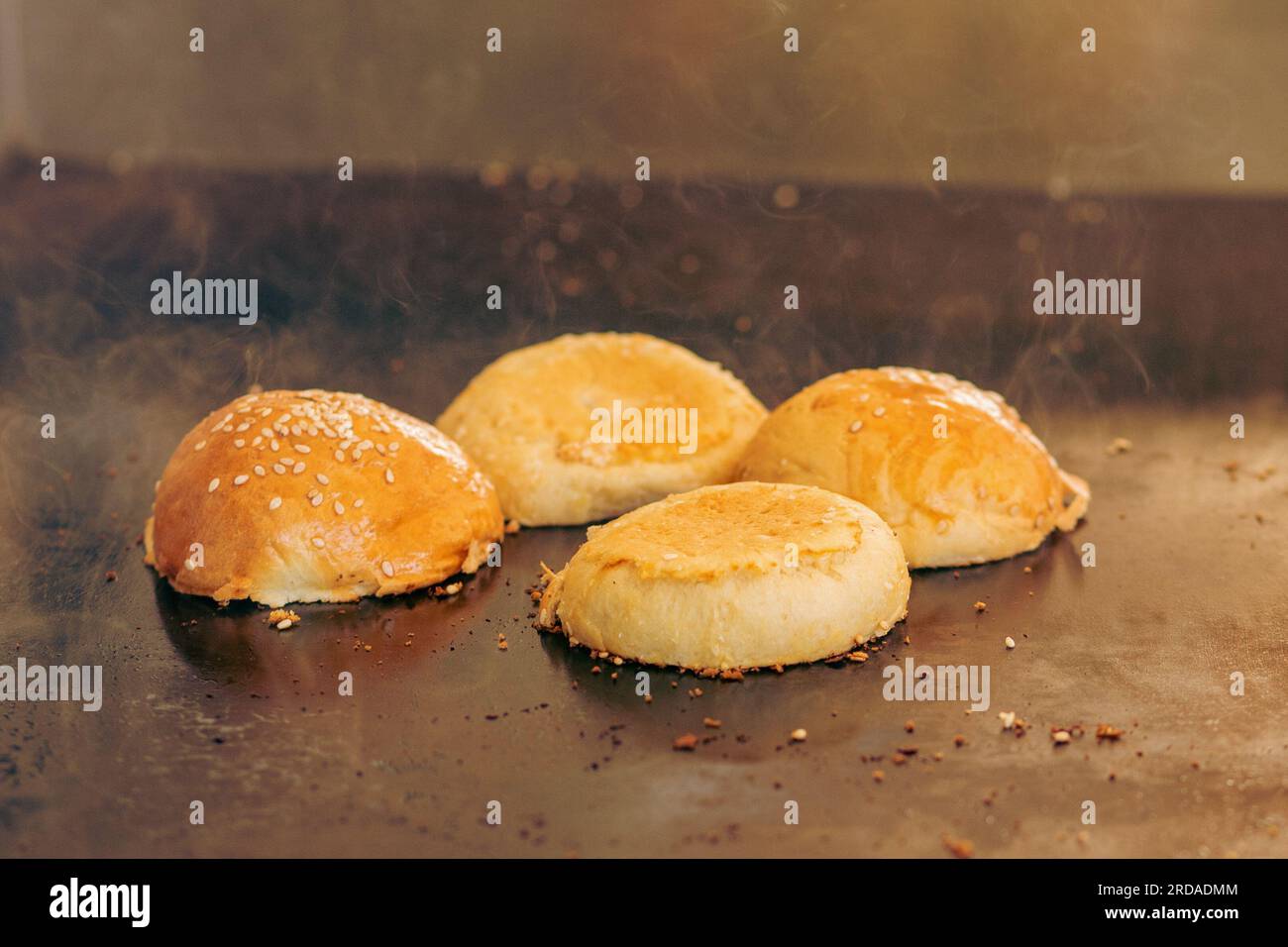 Heating Hamburger Buns on Flat Top Grill Stock Photo Alamy