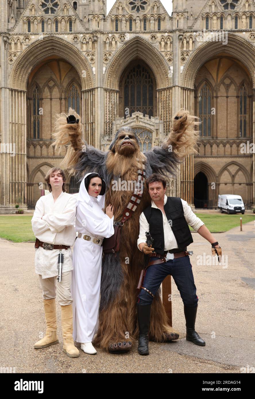 https://c8.alamy.com/comp/2RDAG14/peterborough-uk-18th-july-2023-luke-skywalker-princess-leia-chewbacca-and-han-solo-pose-outside-peterborough-cathedral-before-one-of-the-largest-star-wars-private-fan-collections-in-the-world-can-be-seen-in-the-magnificent-peterborough-cathedral-from-19th-july-the-exhibition-unofficial-galaxies-at-peterborough-cathedral-includes-over-120-exhibits-with-a-life-sized-land-speeder-amongst-on-show-alongside-rare-star-wars-toys-and-items-peterborough-cambridgeshire-uk-credit-paul-marriottalamy-live-news-2RDAG14.jpg