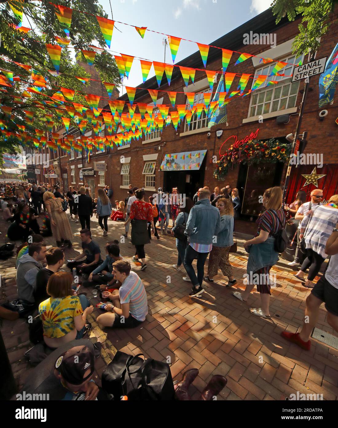 Enjoying Manchester Pride Festival, August bank holiday at the Gay Village, Canal St, Manchester, England, UK, M1 6JB Stock Photo